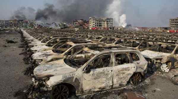 China investigates cause of blasts at Tianjin port, firms assess damage