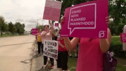 Planned Parenthood supporters rally outside U.S. Congressman’s office